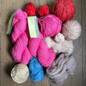 Pink, red and blue natural fiber yarn